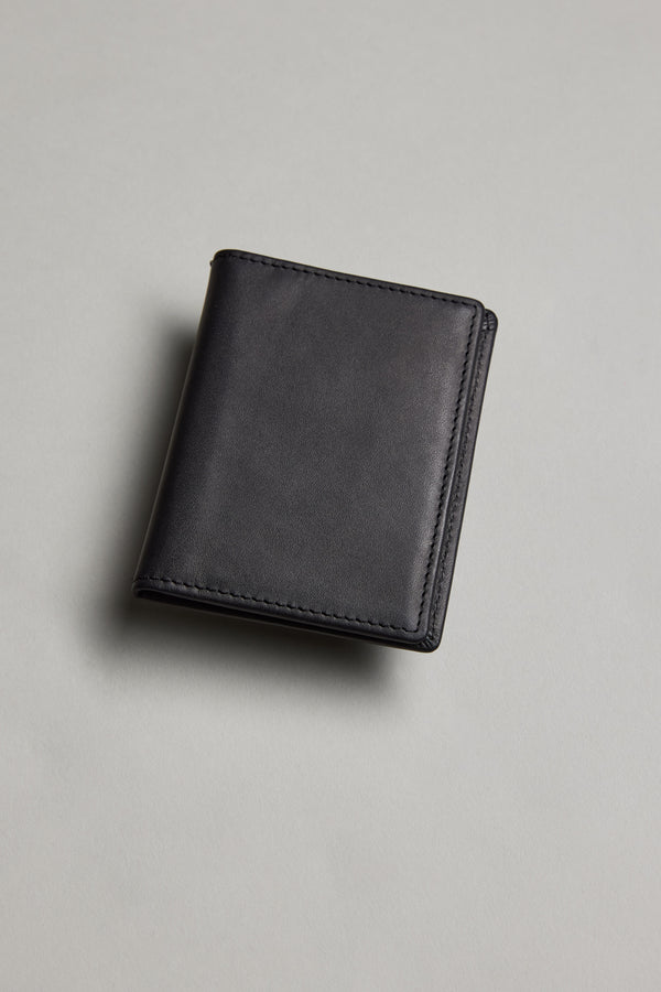 A closed Marlin Leather Slim Wallet by Barkers rests on a light grey surface, shown from above.