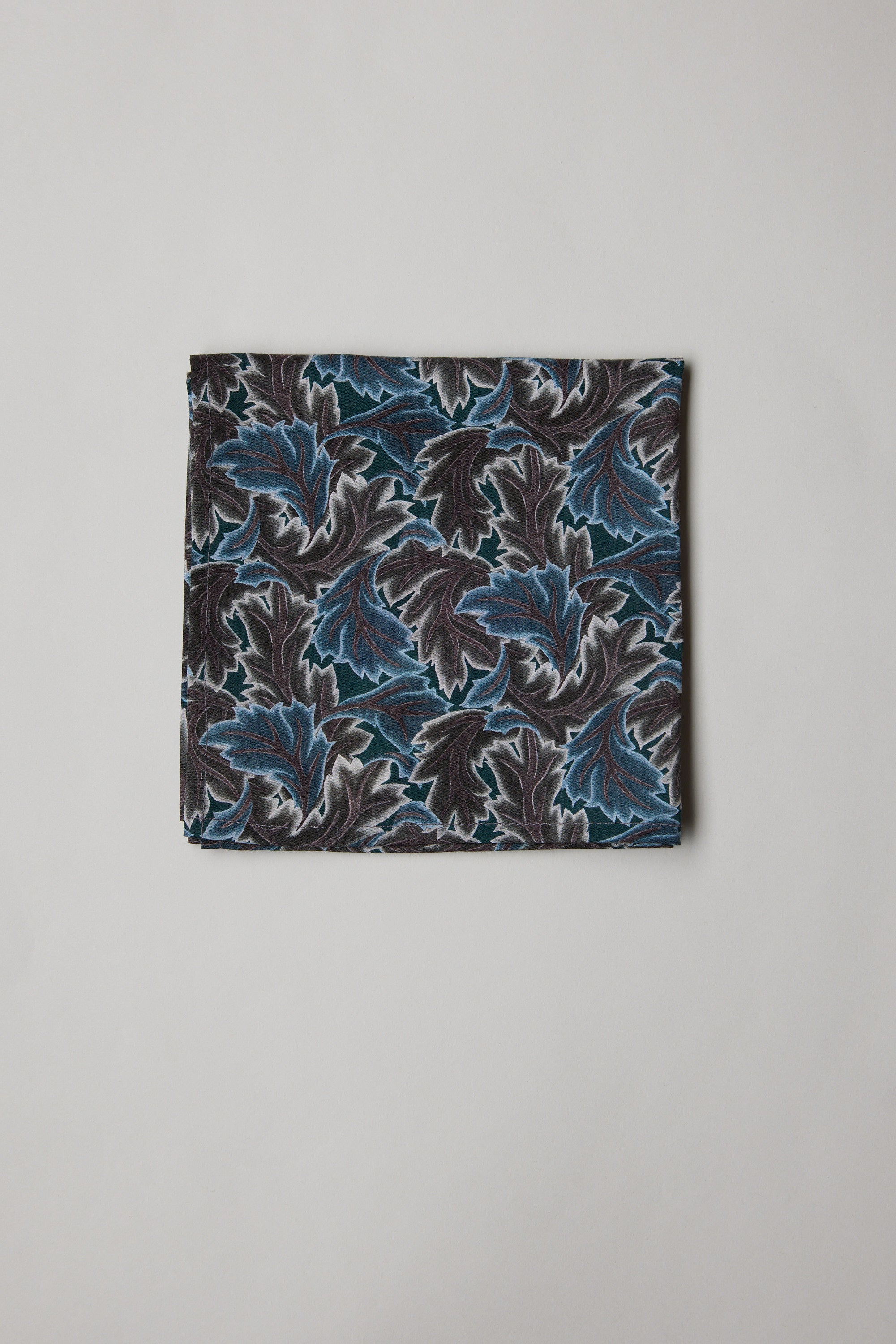 Liberty Midnight Canopy Pocket Square in blue, black & white leafy print on light background.
