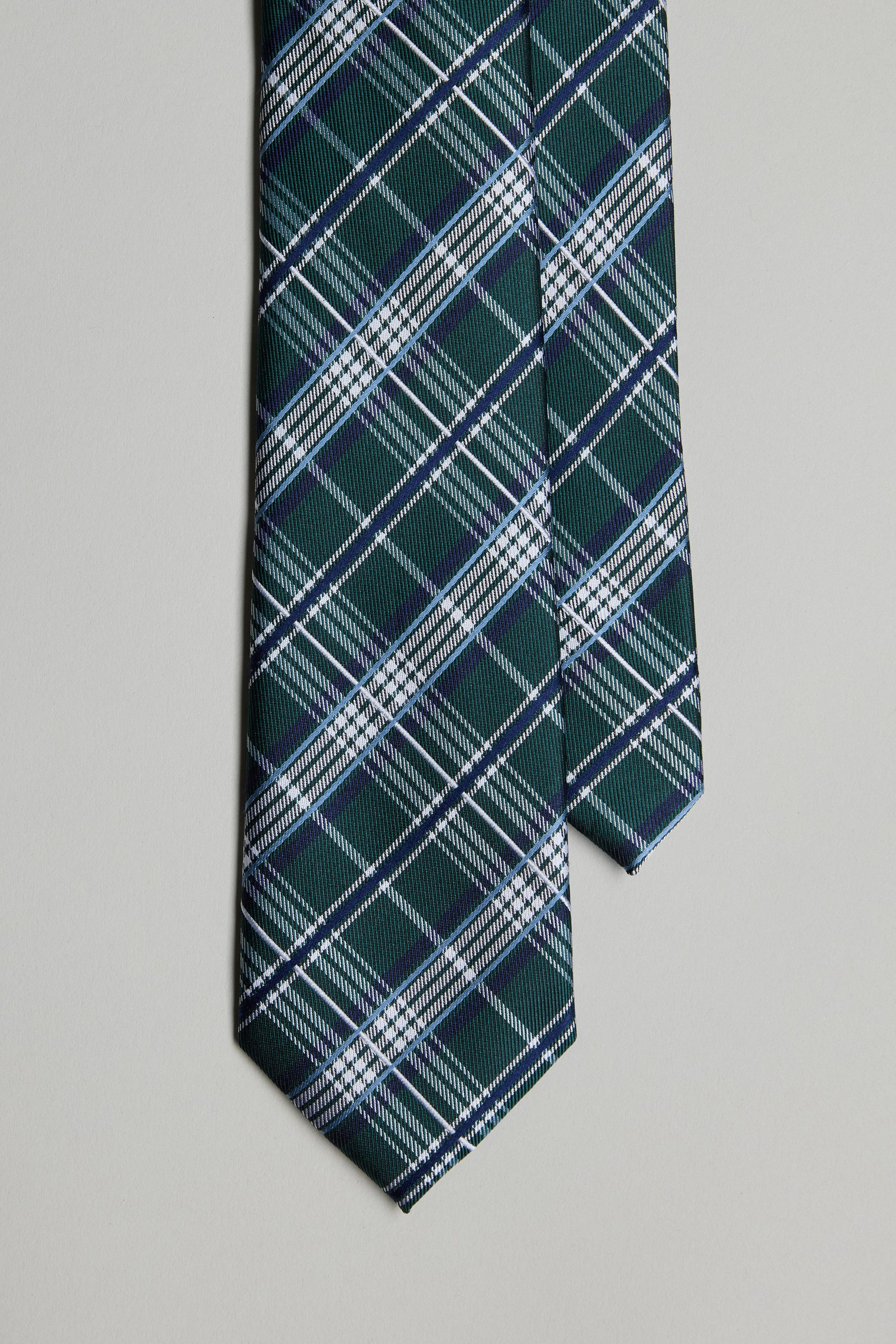 The Barkers Tampa Check Tie features a green base with a diagonal white and blue plaid pattern, shown against a light gray background.