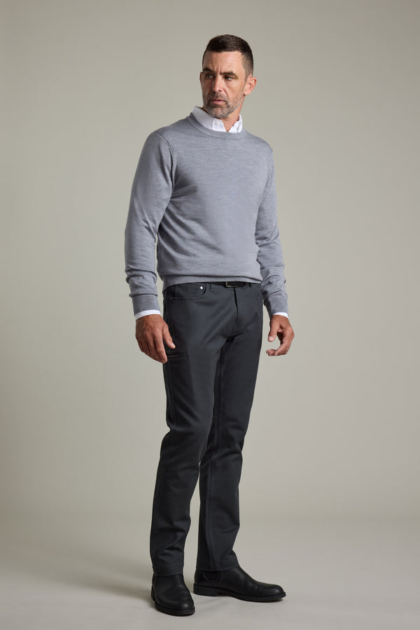 Man in a gray Barkers Skyland ZQrx Merino Crew, white shirt, dark pants; plain background.