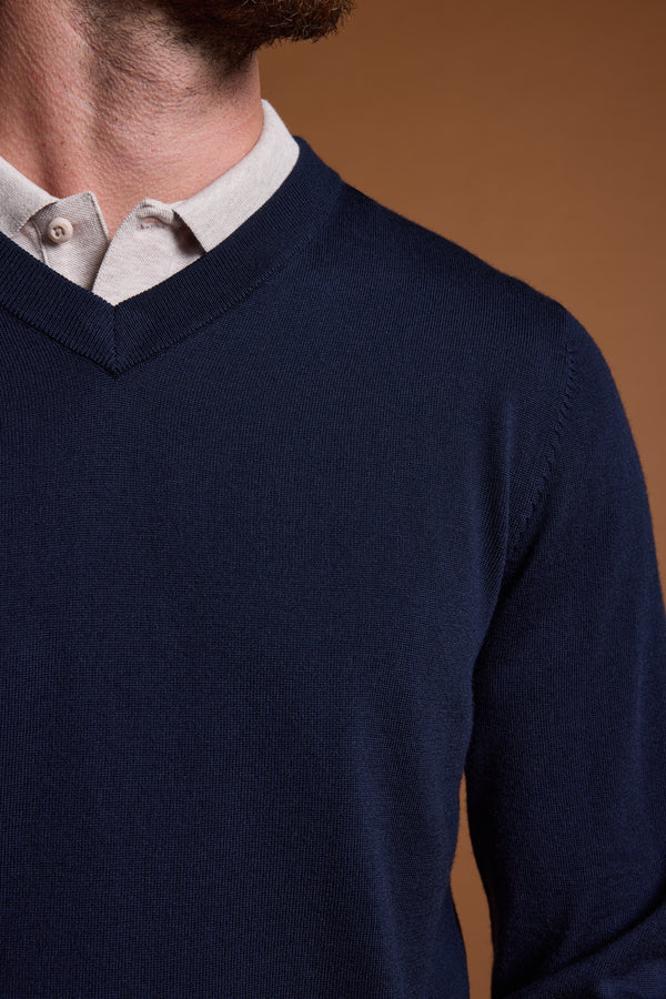 Man in Barkers Skyland ZQrx Merino Vee, navy blue, over a light beige collared shirt.
