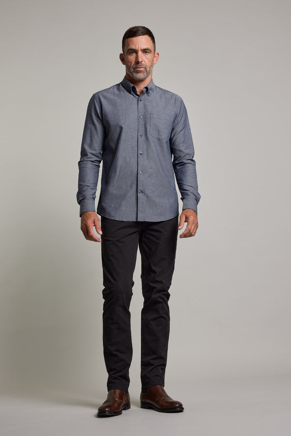 A man stands facing forward, wearing the Barkers Tyson Texture Shirt, black pants, and brown shoes against a plain light gray background.