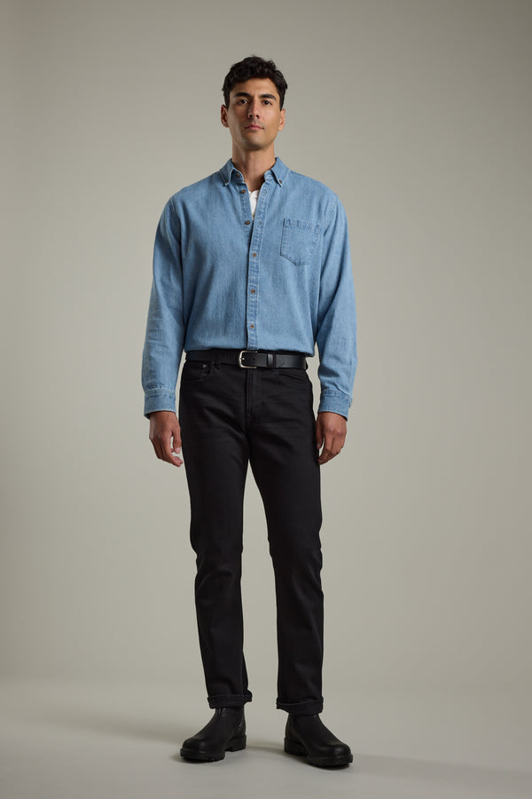 Man in a Barkers Avalon Denim Shirt, black jeans, and boots against a plain background.