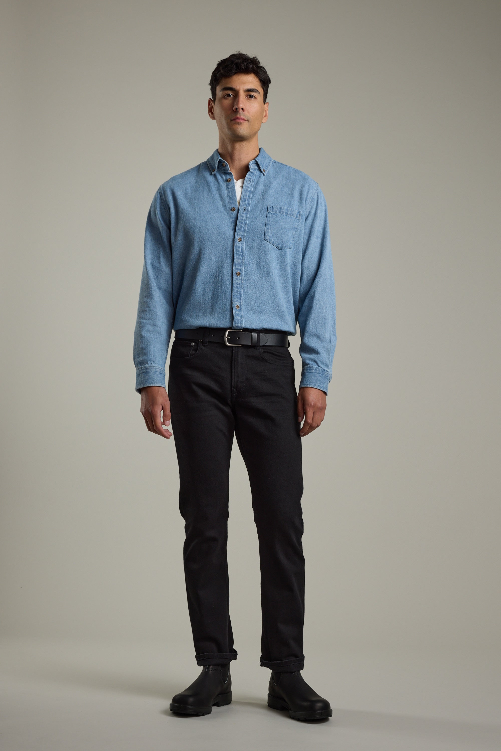 Man in a Barkers Avalon Denim Shirt, black jeans, and boots against a plain background.