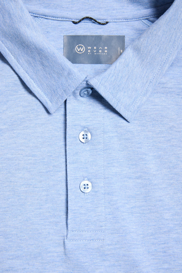 Close-up of a light blue WearEver Outbound Polo with three buttons and a visible neckline label, crafted from breathable cotton-blend fabric for comfort.