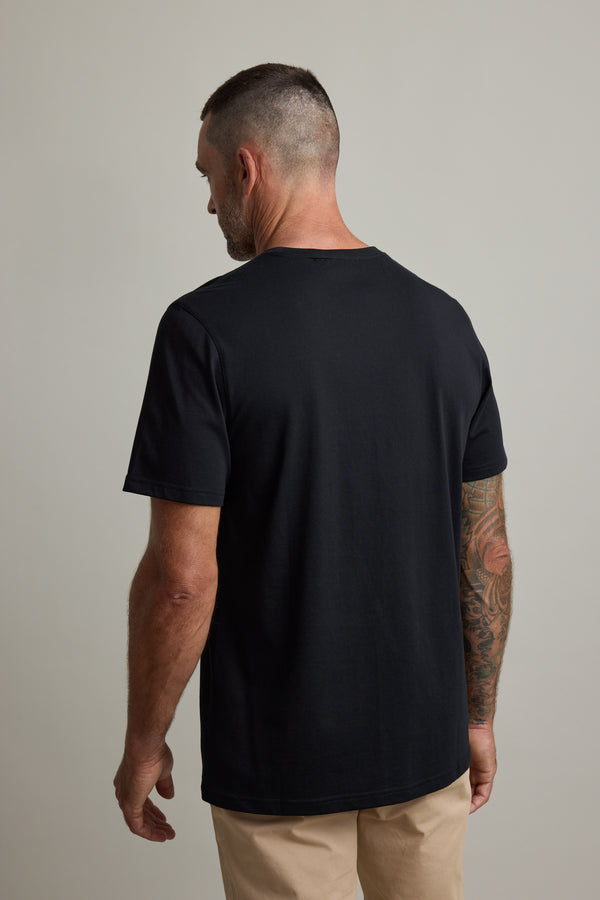 Tattooed man faces away in Barkers Good Earth Cotton Essential Tee.
