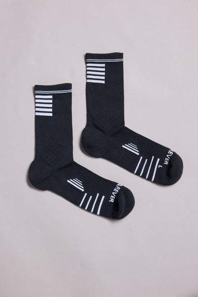 A pair of black WearEver Active Socks by WearEver with white stripes near the cuffs and toes, “FEVER” text, and “L” and “R” markings, laid flat on a light gray background.