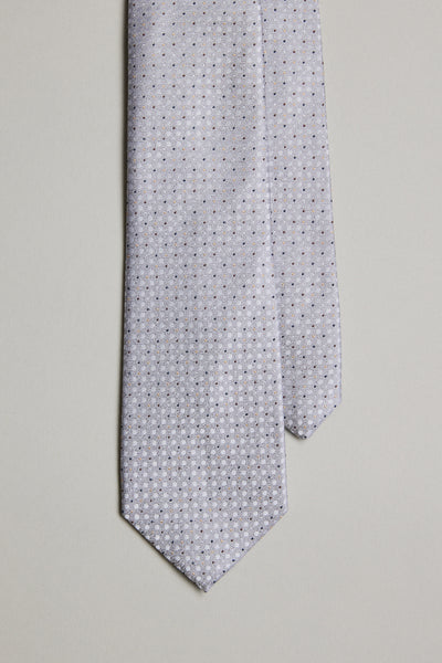 The Barkers Nilson Dot Tie, crafted from fine silk, features a light gray color with a small repeating geometric dot pattern, shown up close against a plain light background.