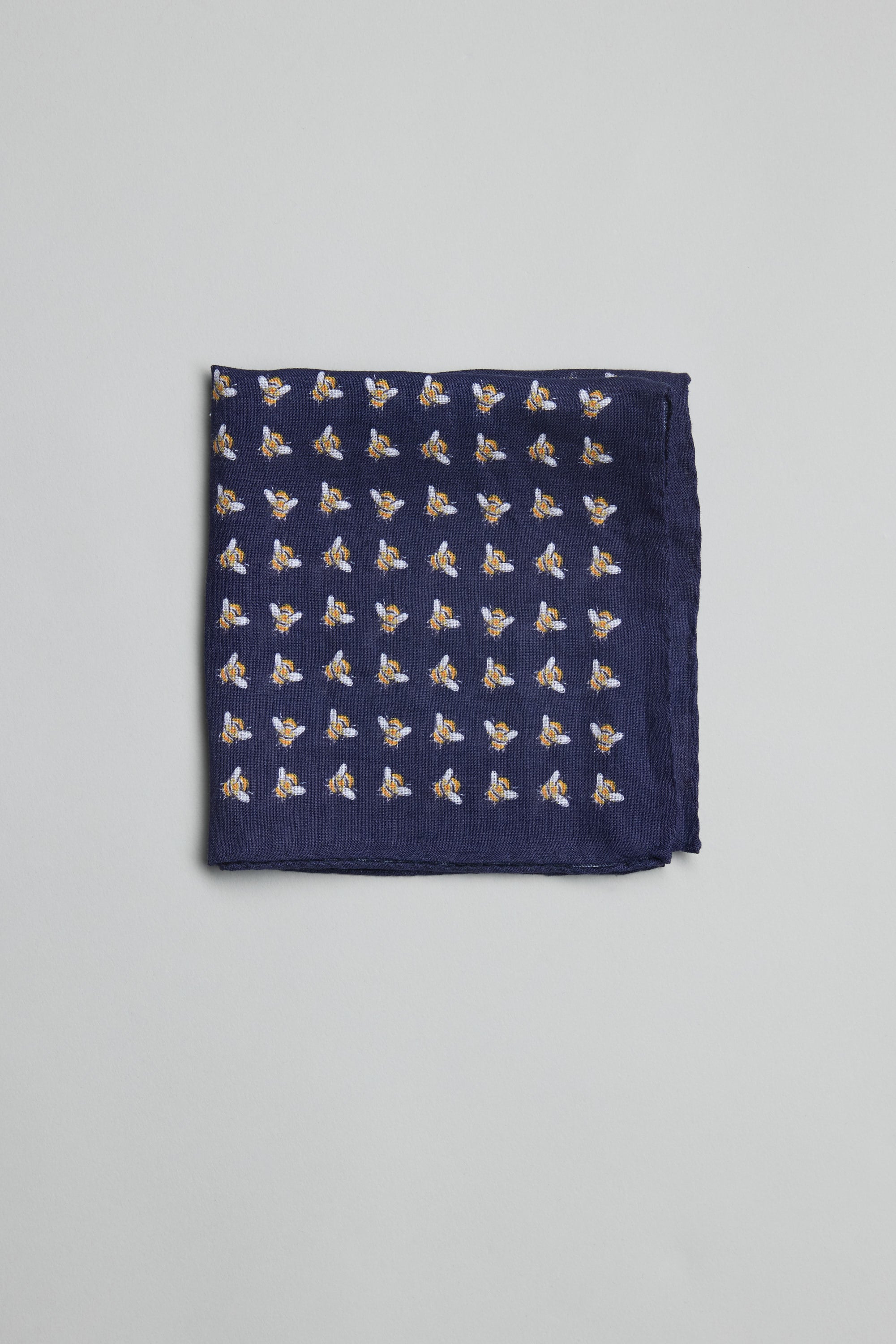 Handmade in New Zealand, the Parisian Bee Linen Pocket Square adds flair to men's style.