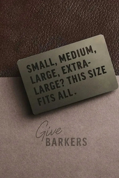 A digital card on a leather and paper background reads, SMALL, MEDIUM, LARGE, EXTRA-LARGE? THIS SIZE FITS ALL. Below, Give a Barkers Digital Gift Card—New Zealand’s perfect fit—is printed on the paper.