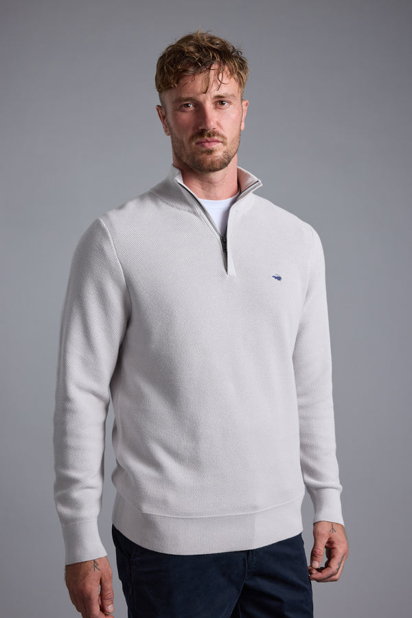 Man wears Barkers Gaston Cotton 1/4 Zip Sweater, standing against a plain background.