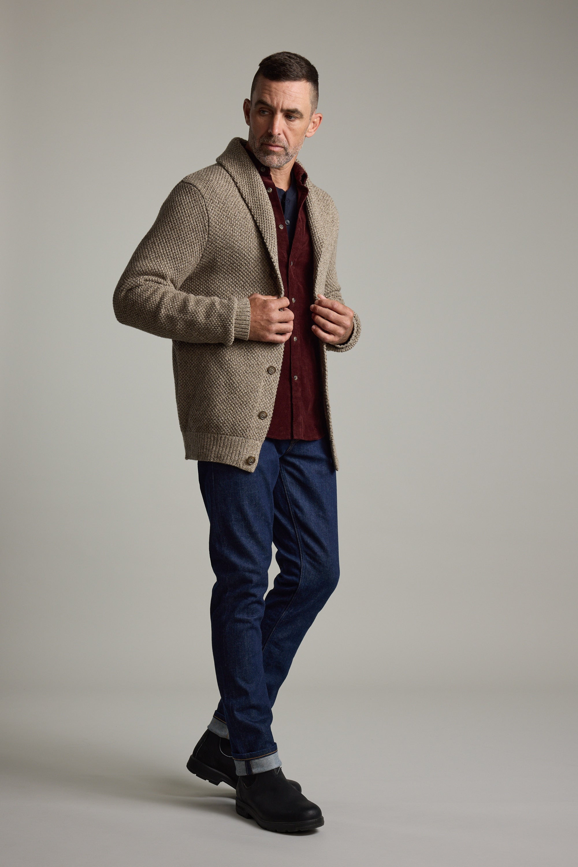 Man in Barkers Rudder Cotton Shawl Cardi and boots, perfect for winter layering.
