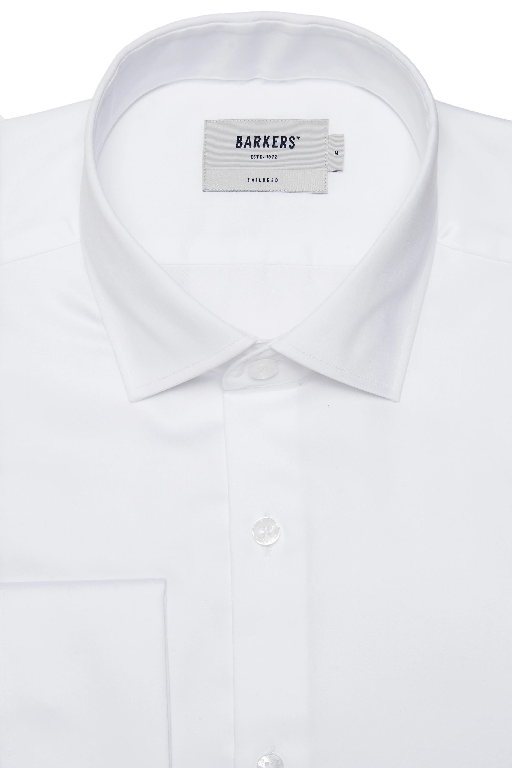 Close-up of the Barkers Tribeca French Cuff Shirt—a white tailored fit with a classic collar, white buttons, and a Barkers label inside the collar. This formal dress shirt is neatly pressed and photographed on a plain background.