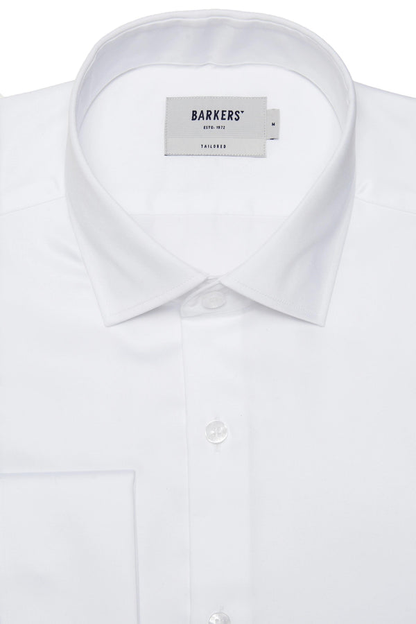 Close-up of the Barkers Tribeca French Cuff Shirt—a white tailored fit with a classic collar, white buttons, and a Barkers label inside the collar. This formal dress shirt is neatly pressed and photographed on a plain background.