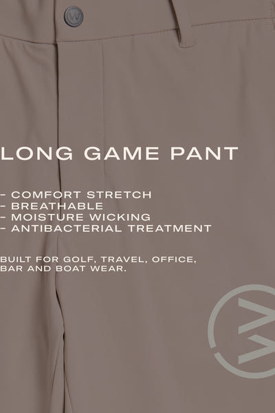 Close-up of WearEver Long Game Pant in beige, featuring a chino-inspired design. Lightweight, breathable, moisture-wicking, stretch fabric with antibacterial treatment. Ideal for golf, travel, office, bar, or boat. WearEver logo visible.