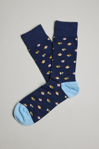 The Barkers Freshport Sushi Sock features a fun navy blue design with light blue toe and heel, plus a colorful all-over print of small leaves in yellow, pink, and orange. Displayed flat on a neutral background.