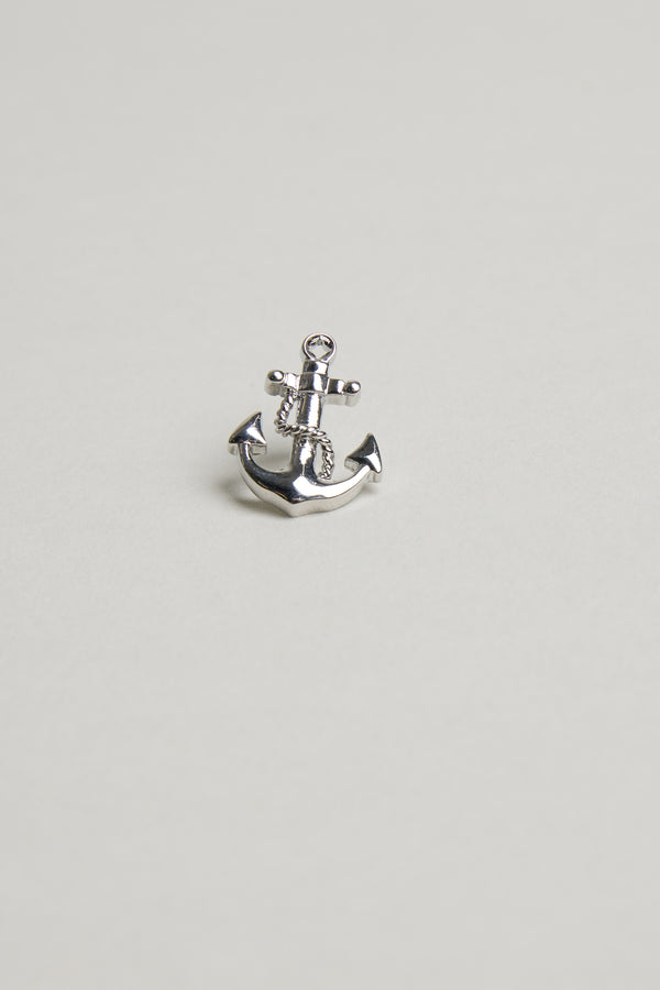 The Barkers Anchor Lapel Pin, a small shiny silver accessory shaped like an anchor, is displayed centered on a plain light gray background—ideal for nautical style or as a gift for ocean lovers.