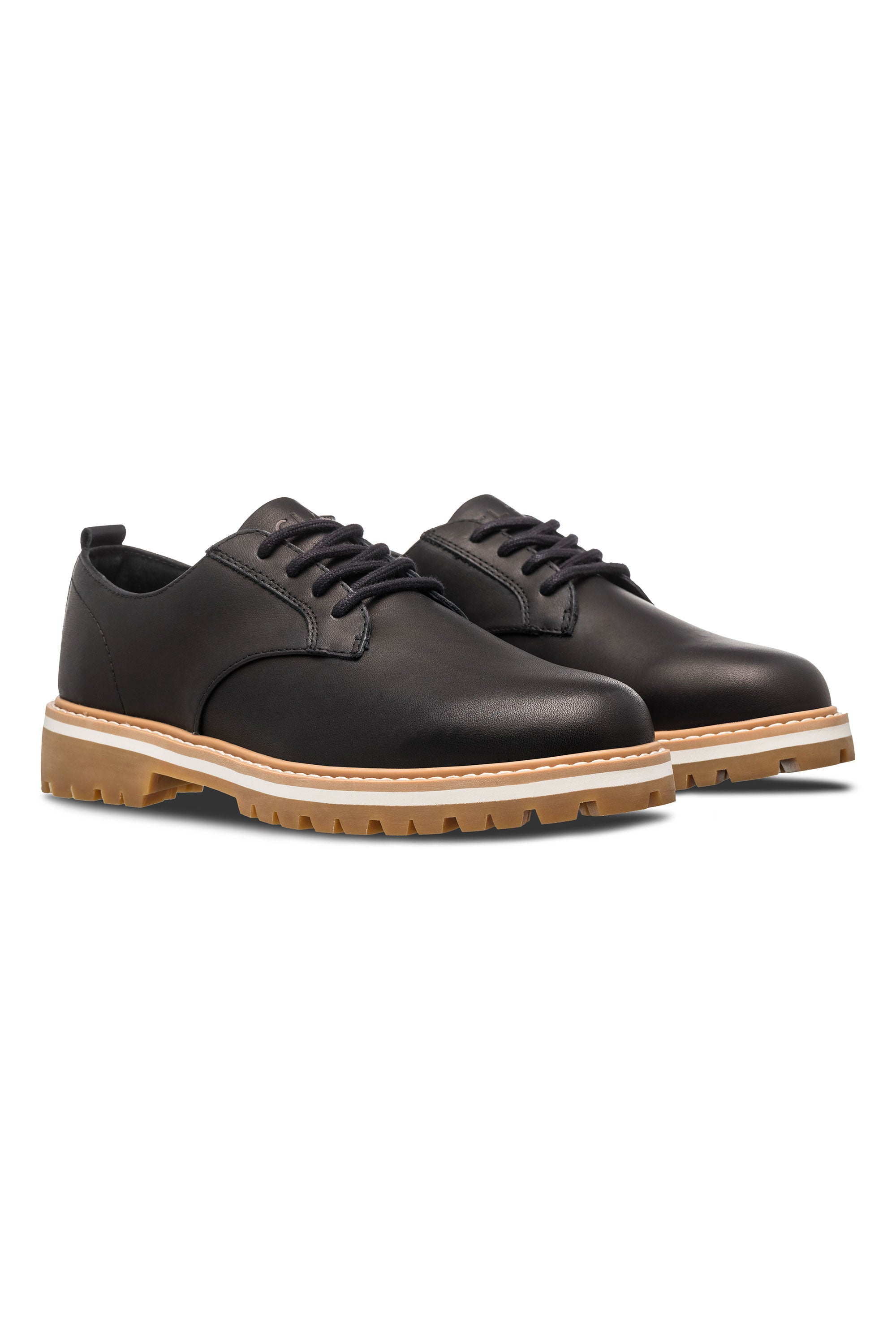 CLAE Logan shoes in black leather with tan rubber soles, displayed on a white background.