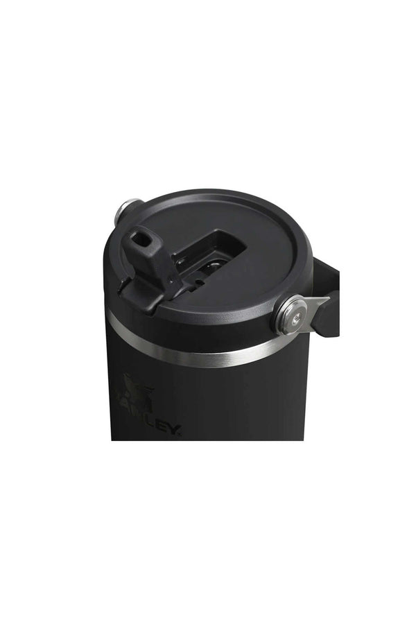 A close-up of the Stanley IceFlow Flip Straw Tumbler 30 OZ in black, featuring a lid with a flip straw and sturdy silver handle—ideal for keeping drinks hot or cold with its vacuum insulation.